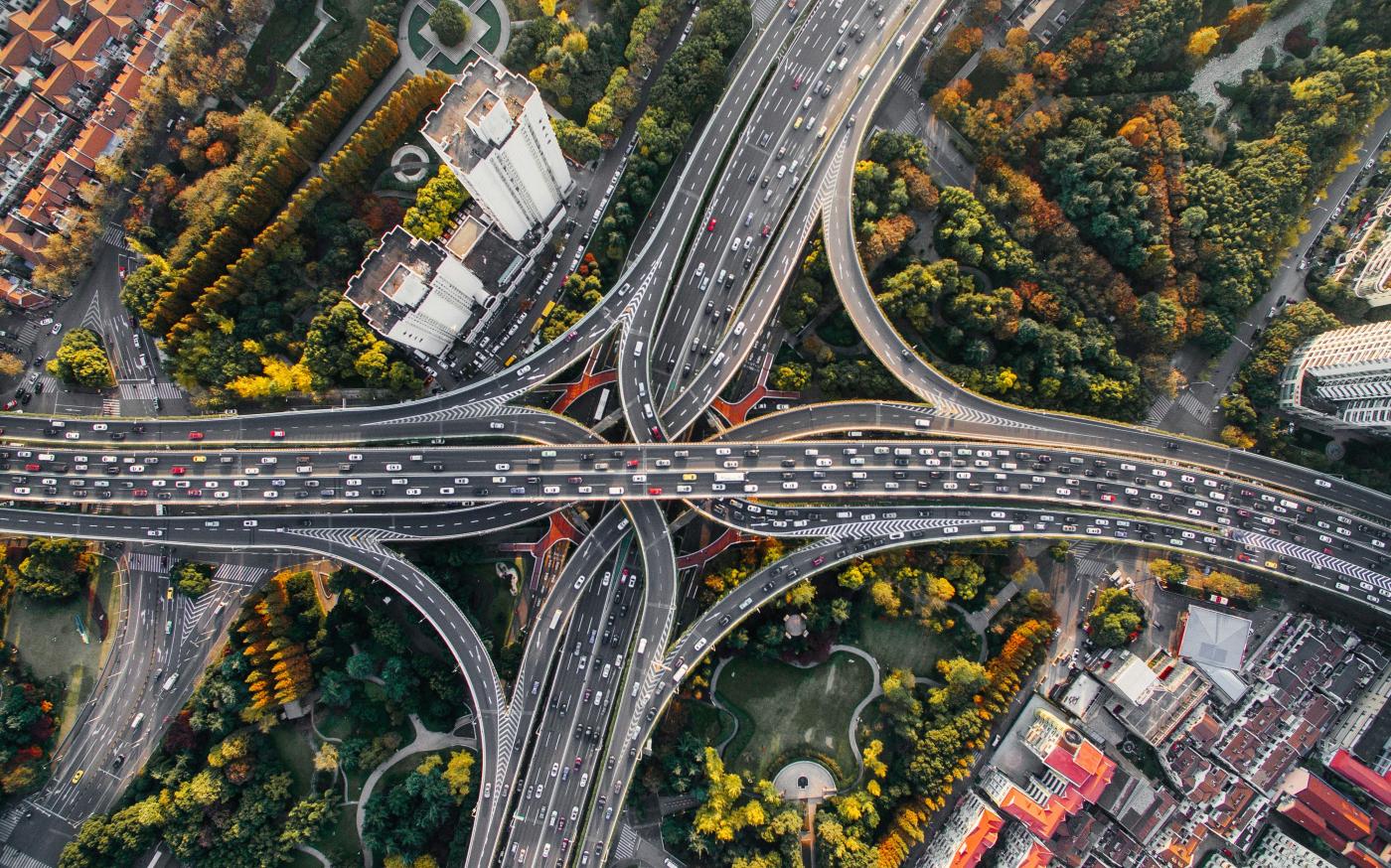 aerial photography of concrete roads by Denys Nevozhai courtesy of Unsplash.