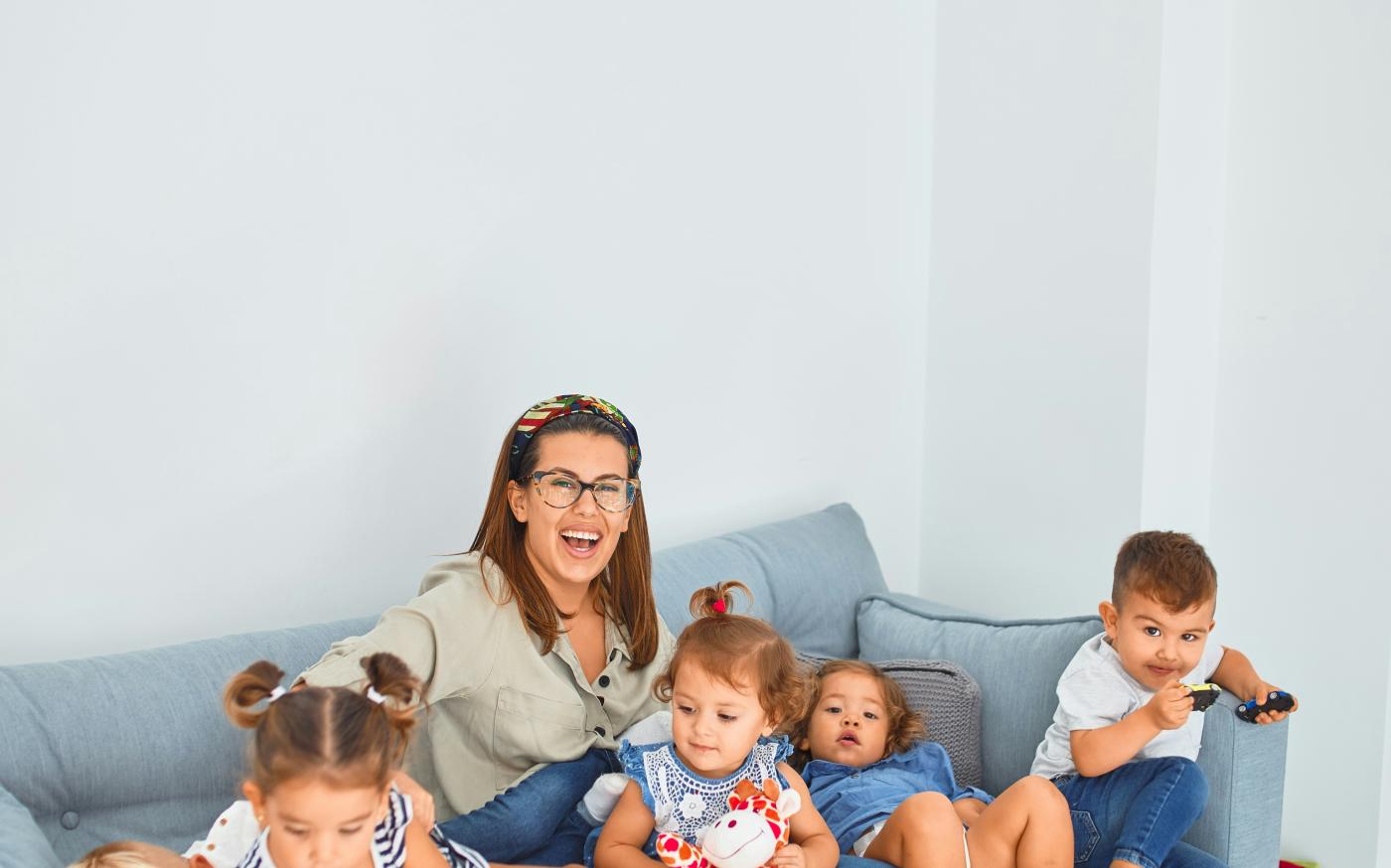 3 women sitting on gray couch by krakenimages courtesy of Unsplash.