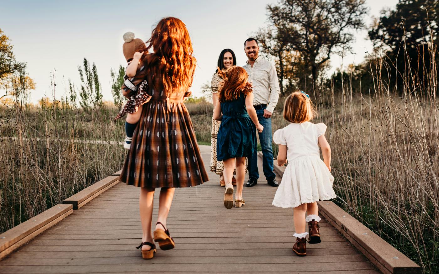woman carrying baby by Jessica Rockowitz courtesy of Unsplash.