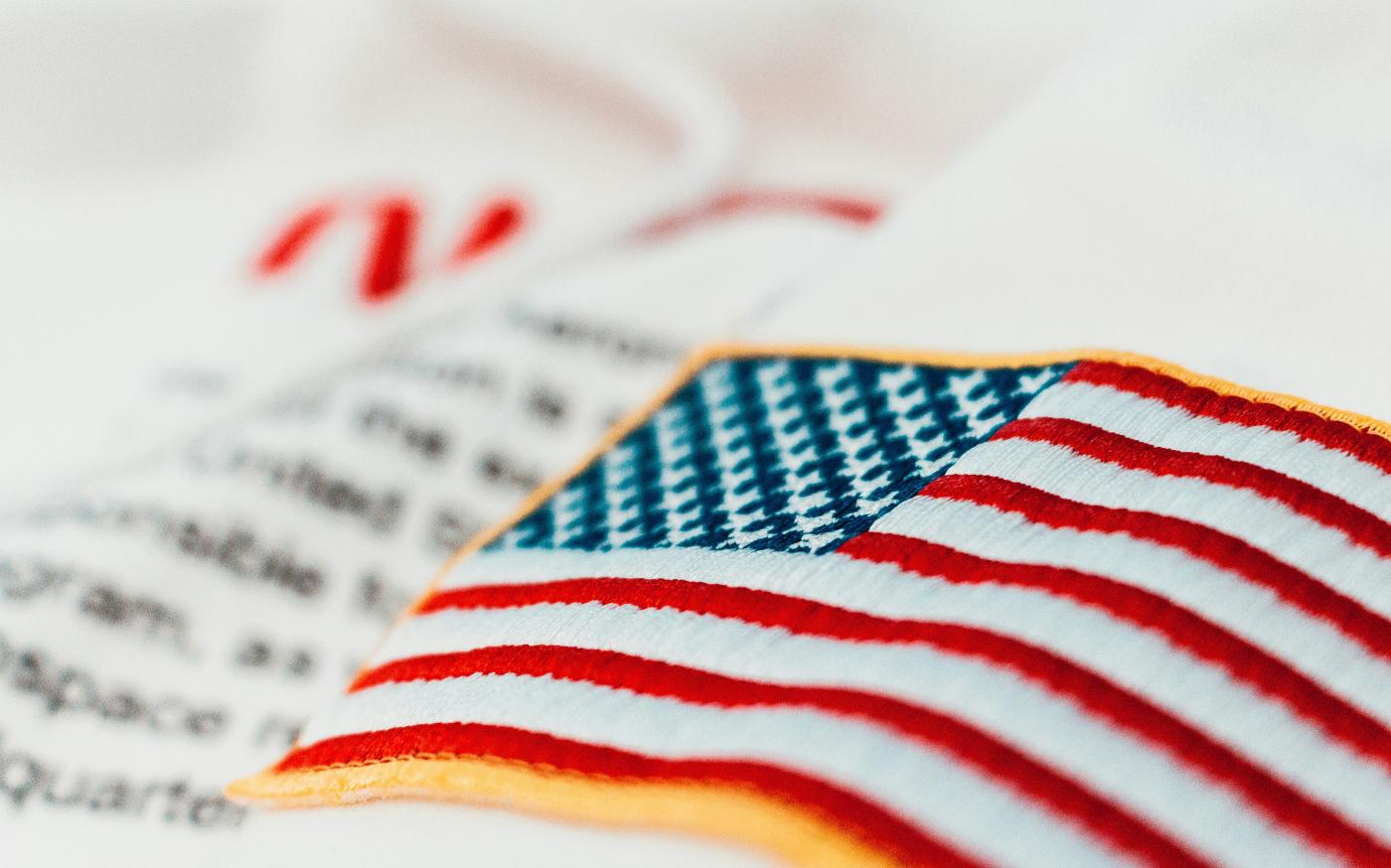 United States of America flag embroidery by Jannis Lucas courtesy of Unsplash.