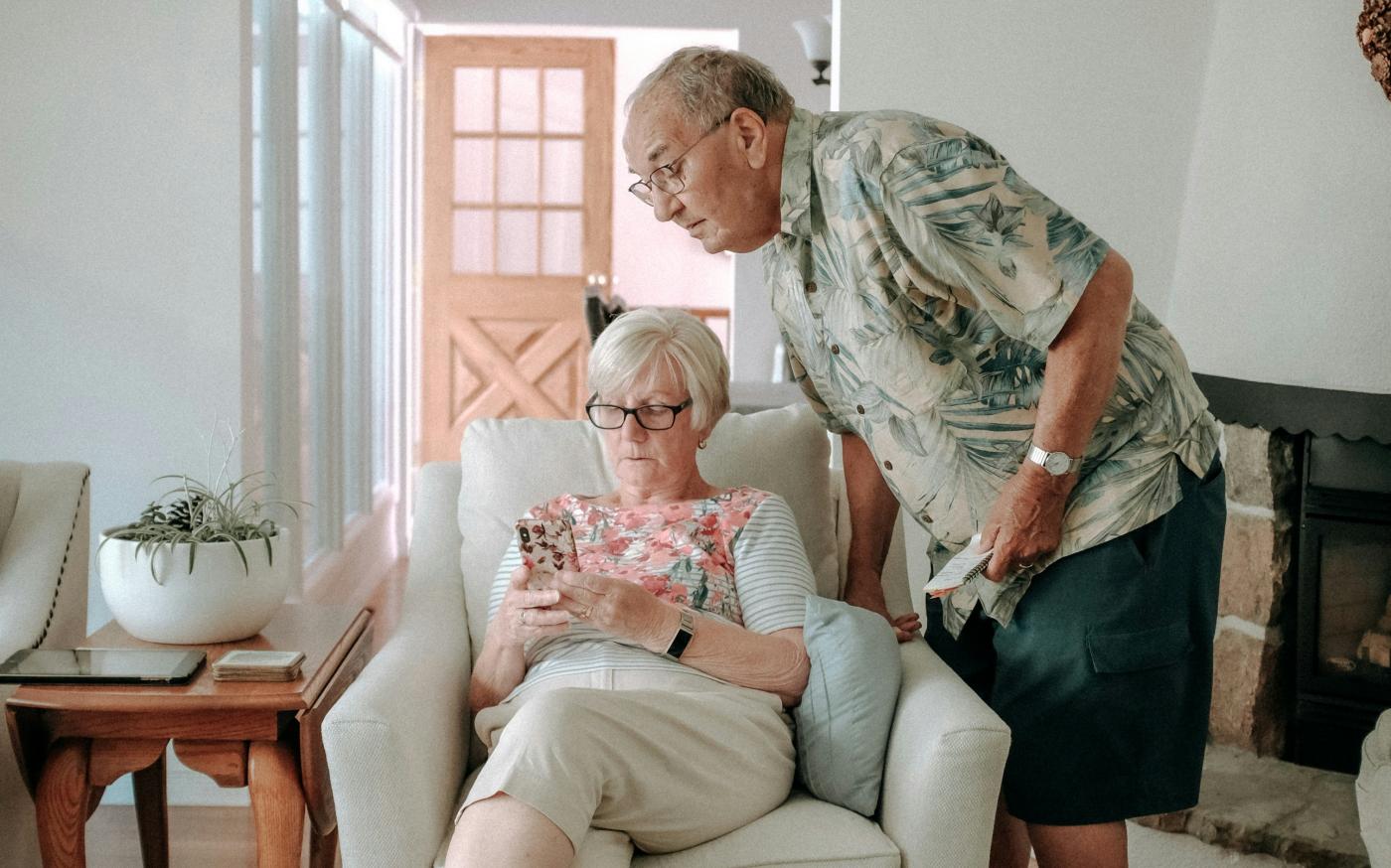 a woman and a man in a living room by Keith Tanner courtesy of Unsplash.