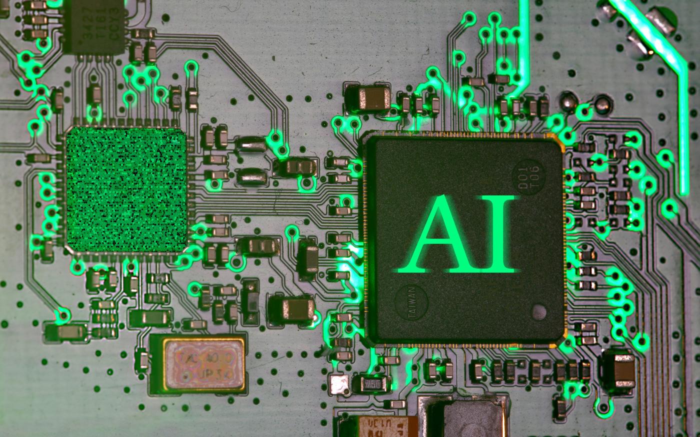 Glowing ai chip on a circuit board. by Immo Wegmann courtesy of Unsplash.