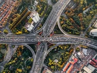 aerial photography of concrete roads by Denys Nevozhai courtesy of Unsplash.