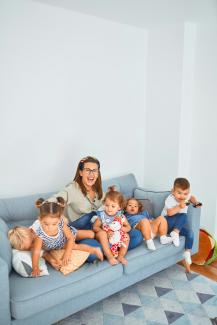 3 women sitting on gray couch by krakenimages courtesy of Unsplash.