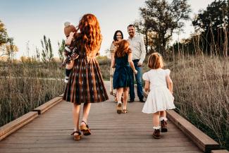 woman carrying baby by Jessica Rockowitz courtesy of Unsplash.