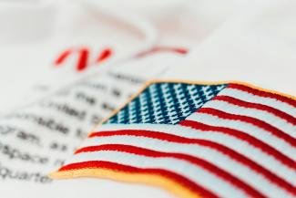 United States of America flag embroidery by Jannis Lucas courtesy of Unsplash.