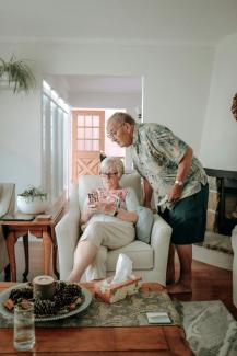 a woman and a man in a living room by Keith Tanner courtesy of Unsplash.