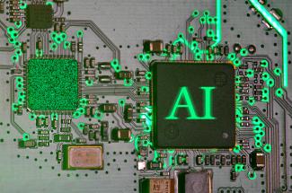 Glowing ai chip on a circuit board. by Immo Wegmann courtesy of Unsplash.