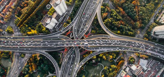 aerial photography of concrete roads by Denys Nevozhai courtesy of Unsplash.