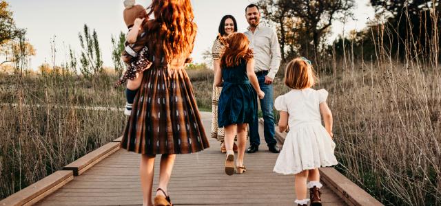 woman carrying baby by Jessica Rockowitz courtesy of Unsplash.