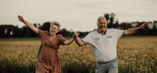 a man and woman jumping in the air by Isak Pettersson courtesy of Unsplash.
