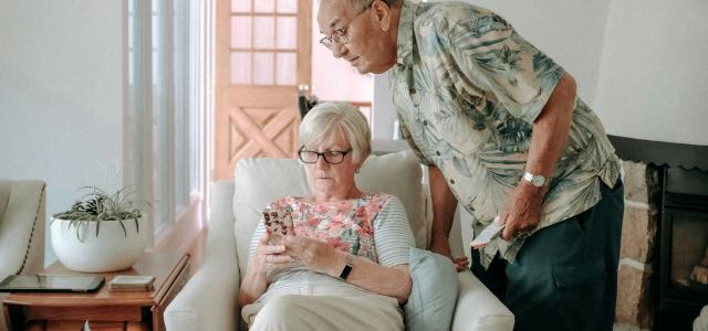 a woman and a man in a living room by Keith Tanner courtesy of Unsplash.